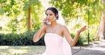 Phone call, upset and a bride in a garden on her wedding day, arguing or feeling angry at bad news. Marriage, mobile and contact with a woman in a white dress having an unhappy conversation outside