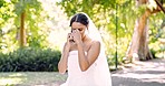 Crying, talking and a woman on a phone call in a wedding dress for marriage fail in the city. Sad, communication and a bride speaking on a mobile for marital problem, stress or relationship conflict