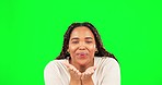 Blowing kiss, smile and woman face in green screen with love and romantic emoji gesture. Isolated, studio background and young female portrait with loving and romance hand sign feeling happy