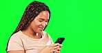 Woman, smartphone and typing on green screen, mockup studio and social media post online. Female model texting on cellphone, download mobile games and search digital contact app on mock up background