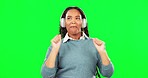 Headphones, dance and woman in studio with green screen listening to music, radio or playlist. Energy, smile and happy African female model dancing to song or album isolated by chroma key background.