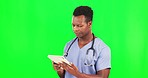 Doctor, black man and tablet by green screen for reading bad news, report or diagnosis in health mockup. Male african medic, mobile touchscreen or disappointed face for information, research or chat
