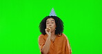 Happy birthday, celebration and black woman on green screen, party and fun with kazoo on studio background. Female is excited to celebrate, energy and mockup space with freedom and happiness