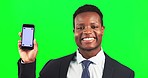 Happy, face and a black man with a phone on a green screen isolated on a studio background. Mockup, tracking markers and portrait of an African businessman showing a mobile for an app or text