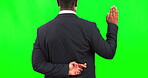 Fingers crossed, oath and dishonesty with a business man on a green screen background in studio from the back. Justice, fraud and trial with a corrupt male employee lying about legal allegations