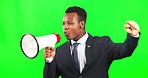 Protest, speaking and a black man with a megaphone on a green screen isolated on a studio background. Shouting, riot and an African businessman speaking for change, announcement and public opinion