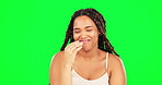 Comic, funny and humor with a black woman on a green screen background laughing or joking in studio. Comedy, laughter and smile with a happy young female feeling playful or carefree on chromakey