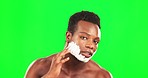 Black man, face and cream to shave on green screen, grooming and hygiene with beauty on studio background. Portrait, skincare and facial hair removal with serious male, mockup space and dermatology