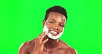 Black man, shaving cream on face and green screen, grooming and hygiene with beauty on studio background. Portrait, skincare and facial hair removal with happy male, mockup space and dermatology