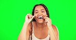 Green screen, face and happy woman flossing teeth in studio for healthy dental wellness. Portrait of female model, oral thread and cleaning mouth for fresh breath, tooth maintenance and care of smile