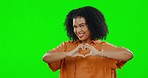 Face, heart and hands on green screen of happy woman on studio background for hope, peace and trust. Portrait, female model and sign of love, support and kindness for care, emoji and icon on mockup