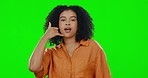 Phone call, hand gesture and portrait of happy woman on green screen with smile, pointing and choice. Contact us, advertising and happiness, girl in studio with telephone sign with hands in mockup.