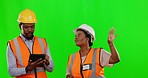 Green screen, engineer and employees with a tablet, planning and industrial builders on studio background. Architecture, coworkers or man with woman, inspector or architect with device or development