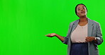 Portrait, about us and a business black woman on a green screen background in studio for promotion. Marketing, presentation and information with a female employee talking on chromakey mockup