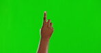Hand, green screen and interface with a person or user in studio using an interactive ui or ux dashboard. App, internet and space with an adult indoor to click, press or push a button on chromakey