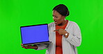 Shocked, pointing and laptop with black woman on green screen for website, 404 glitch and mockup. Social media, news and technology with female on studio background for internet, digital and surprise