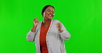 Green screen, happy and black woman dancing in celebration after winning isolated in a studio background. Music, happiness and excited female person with energy dance to celebrate a fun party