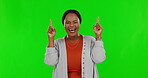 Green screen, mockup and black woman pointing at product placement, deal or promotion isolated in a studio background. Happy, advertising and excited female person showing sale or promo