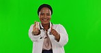 Black woman, doctor and pills with thumbs up on green screen for healthcare insurance against a studio background. Portrait of happy African female medical expert showing thumb emoji for medication