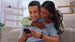 Happy couple, love and hug with cellphone in living room, social media post and online subscription. Young man, woman and partner hugging with smartphone connection, networking and mobile app at home