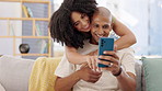 Couple, hug and phone on sofa smile in home, social media or online browsing in living room. Happiness, cellphone and man and woman hugging, cuddle or embrace while bonding, web scrolling or internet