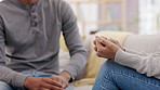 Hands, love and empathy with a couple on a sofa in the living room for their home for support, trust or care. Help, compassion or comfort with a man and woman consoling during pain, loss or grief