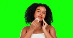 Face, green screen and woman with skincare, cotton pad and cosmetics against a studio background. Portrait, female person and model with makeup remover, products and cleaning for smooth and soft skin