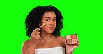 Green screen, portrait of woman with makeup and brush for foundation power with mockup for facial product placement. Beauty, skincare and natural cosmetics on face for model in cosmetic skin routine.