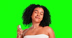 Happy, face and a woman with perfume on a green screen isolated on a studio background. Smile, smelling and portrait of a girl spraying a fragrance for scent on skin, enjoying aroma and grooming