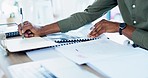 Hands, black man or financial accountant writing on finance documents or paperwork company sales. Closeup, calculator or African employee accounting data analytics on budget spreadsheet in office