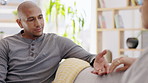 Sad, comfort and a couple holding hands on the sofa for support, love and consoling. Depression, discussion and a man and woman with affection during a conversation about a problem on the couch