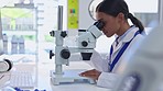 Science, microscope and Indian woman in laboratory for research, dna test and medical analytics. Healthcare, biotechnology and female scientist with equipment for vaccine, virus cure and petri dish