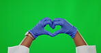 Hands, heart and medical with a doctor on a green screen background to promote health or wellness. Healthcare, consultant and emoji with a medicine professional on chromakey mockup for insurance