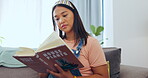 Relax, reading and book with woman on sofa for studying, information and literature. Learning, break and knowledge with female student resting in living room at home for peace, hobby and education