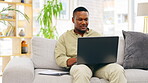 Documents, black man and laptop for remote work in home living room on sofa. Freelancer, paperwork or professional typing on couch with computer for writing email, project research or online browsing