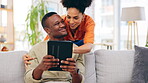 Tablet, smile and couple on sofa in home living room, bonding and online shopping. Interracial, technology and happy black man and woman relax on social media, internet browsing or web scrolling.