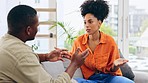 Couple, home and argue on living room sofa with discussion, stress or conflict for affair. Black man, woman and fight in marriage with problem, crisis or frustrated conversation for divorce in lounge