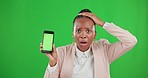 Shock, phone and woman in studio with green screen with a wtf, omg or wow face expression. Surprise, shocked and portrait of an African female model with cellphone or mobile by chroma key background.