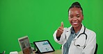 Green screen, happy and doctor with tech and a thumbs up isolated on a studio background. Laptop, thank you and face portrait of a black woman and medical professional with a hand gesture for support