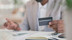 Black man, hands and credit card typing in online shopping, ecommerce or purchase at office desk. Hand of happy African American businessman in electronic transaction or internet banking at workplace