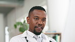 Doctor, black man and typing on computer in office for medical research, review and healthcare data. Medical physician working on desktop for telehealth, planning surgery and life insurance website