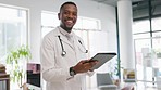 Happy black man, doctor and tablet in healthcare research, communication or Telehealth at hospital. Portrait of African American male medical professional with smile working on touchscreen at clinic