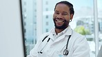 Doctor black man, face and smile at desk with pride, success and confidence in hospital office. African medic, portrait and happy by computer for healthcare, wellness service or telehealth at clinic