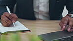 Hands, laptop and writing in notebook with a business man at a desk in his office for company planning. Accounting, administration and strategy with a male employee or manager making a note at work