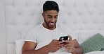 Happy, man and texting on cellphone in bedroom for online dating app, reading social media notification and relax. Guy typing on smartphone in bed, search internet and meme on mobile download at home