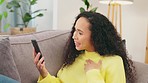 Woman, smartphone and video call with conversation and excited, happy and relax at home with communication. Discussion on phone, gossip and technology with female talking, sitting on couch and smile