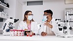 Scientist team, covid mask and blood sample in a laboratory for medical research. Science, DNA testing and lab project with a pharma and hospital employee group with microscope and chemistry check