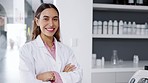 Science, happy and face of a scientist in lab standing with confidence while working on project. Happiness, smile and face of professional woman scientific researcher with crossed arms in laboratory.