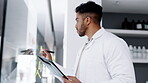 Scientist in laboratory, man brainstorming and writing on glass board for science, medical research and clipboard. Planning, male in lab and scientific study with checklist or results and sticky note