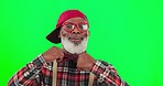 Fashion, face and man in a studio with green screen with a stylish, cool and trendy outfit. Happy, smile and senior African male model with glasses and bowtie posing by a chroma key background.